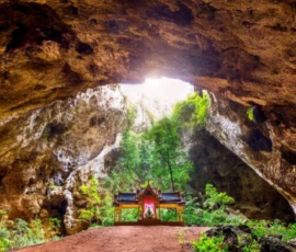 Day 3: Shafts of sunlight pierce the roof of Phraya Nakhon Cave, illuminating the royal pavilion within – one of Thailand's most magical natural spectacles at Sam Roi Yod. Phraya Nakhon Cave royal pavilion sunlit limestone cavern Sam Roi Yod National Park Thailand