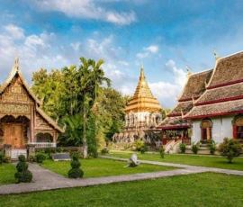 Explore the revered temples and classic Lanna architecture of Chiang Mai’s historic old town at Wat Phra Singh. The beautiful Lanna-style Viharn Lai Kham and the golden pagoda of Wat Phra Singh in Chiang Mai Old Town.
